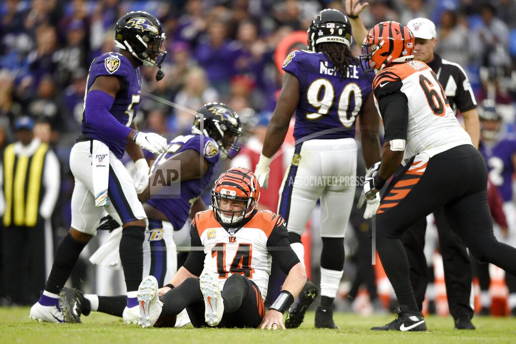 Gail Burton Cincinnati Bengals quarterback Andy Dalton (14) is slow to get up after being sacked by a host of Baltimore Ravens linemen during the second half of a NFL football game Sunday, Oct. 13, 2019, in Baltimore. The Ravens won 23-17. (AP Photo/Gail Burton)