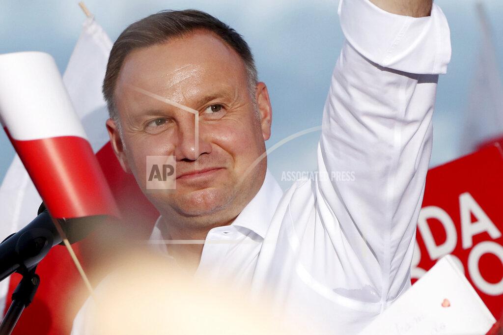 Czarek Sokolowski In this Tuesday, July 7, 2020 photo Poland's incumbent president Andrzej Duda, who is seeking reelection in a tight presidential election runoff on Sunday, July 12, 2020 attends a rally in Lomza, Poland. Duda, who has backing from Poland's ruling right-wing party, is running against liberal Warsaw mayor, Rafal Trzaskowski. Opinion polls suggest the election may be decided by a small number of votes. (AP Photo/Czarek Sokolowski)