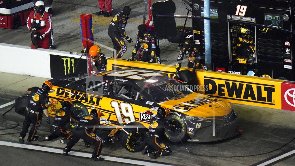 Chris O'meara Martin Truex Jr.'s crew changes tires during a pit stop on the car during the NASCAR Daytona Clash auto race Tuesday, Feb. 9, 2021, at Daytona International Speedway in Daytona Beach, Fla. (AP Photo/Chris O'Meara)