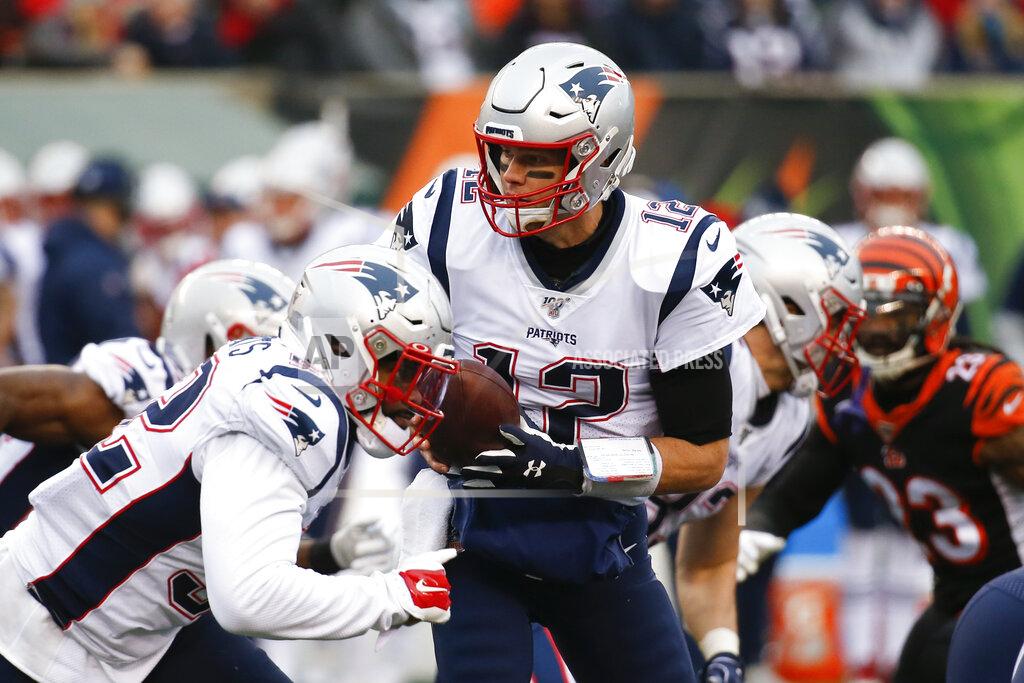 Frank Victores New England Patriots quarterback Tom Brady (12) looks to hand off the ball in the second half of an NFL football game against the Cincinnati Bengals, Sunday, Dec. 15, 2019, in Cincinnati. (AP Photo/Frank Victores)