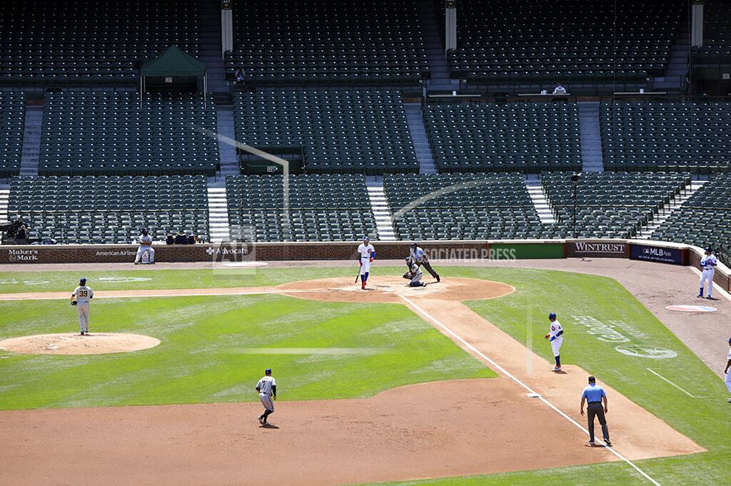 Teresa Crawford A baseball game between the Chicago Cubs and the Milwaukee Brewers is viewed from a rooftop overlooking Wrigley Field, Saturday, July 25, 2020, in Chicago. (AP Photo/Teresa Crawford)