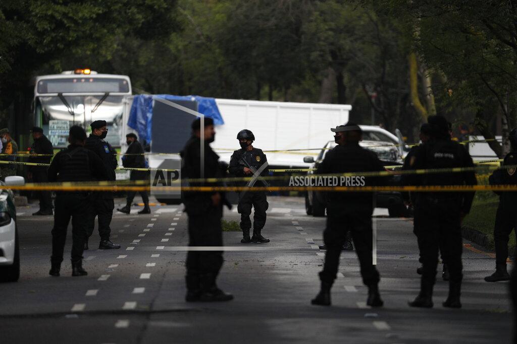 Rebecca Blackwell Police stand guard at a crime scene where the chief of police was attacked by gunmen in the early morning hours, in Mexico City, Friday, June 26, 2020. Heavily armed gunmen attacked and wounded Omar Garcia Harfuch in a brazen operation that left an unspecified number of dead, Mayor Claudia Sheinbaum said Friday. (AP Photo/Rebecca Blackwell)