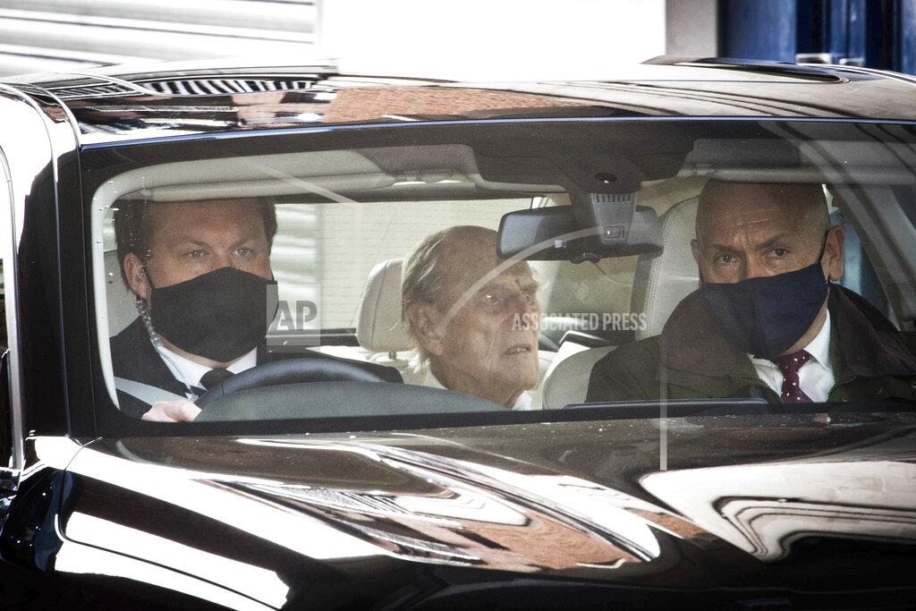 Stefan Rousseau Britain's Prince Philip, centre, as he leaves the King Edward VII hospital in the back of a car in London, Tuesday, March 16, 2021. The 99-year-old husband of Queen Elizabeth II has been hospitalized after a heart procedure. (Stefan Rousseau/PA via AP)