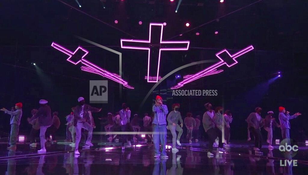 Uncredited In this screen shot provided by ABC on Sunday, Nov. 22, 2020, Justin Bieber performs at the American Music Awards at the Microsoft Theater in Los Angeles. (ABC via AP)