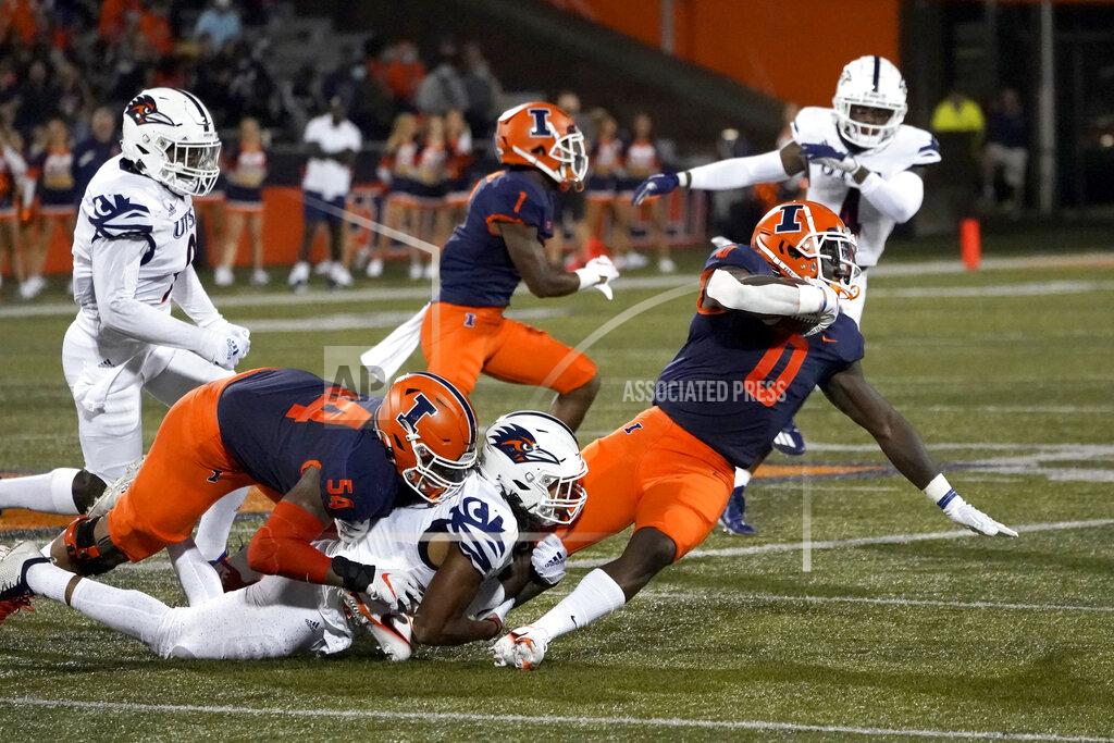 Charles Rex Arbogast Illinois running back Joshua McCray (0) is tackled by UTSA's Jamal Ligon while carrying the ball during the first half of an NCAA college football game Saturday, Sept. 4, 2021, in Champaign, Ill. (AP Photo/Charles Rex Arbogast)
