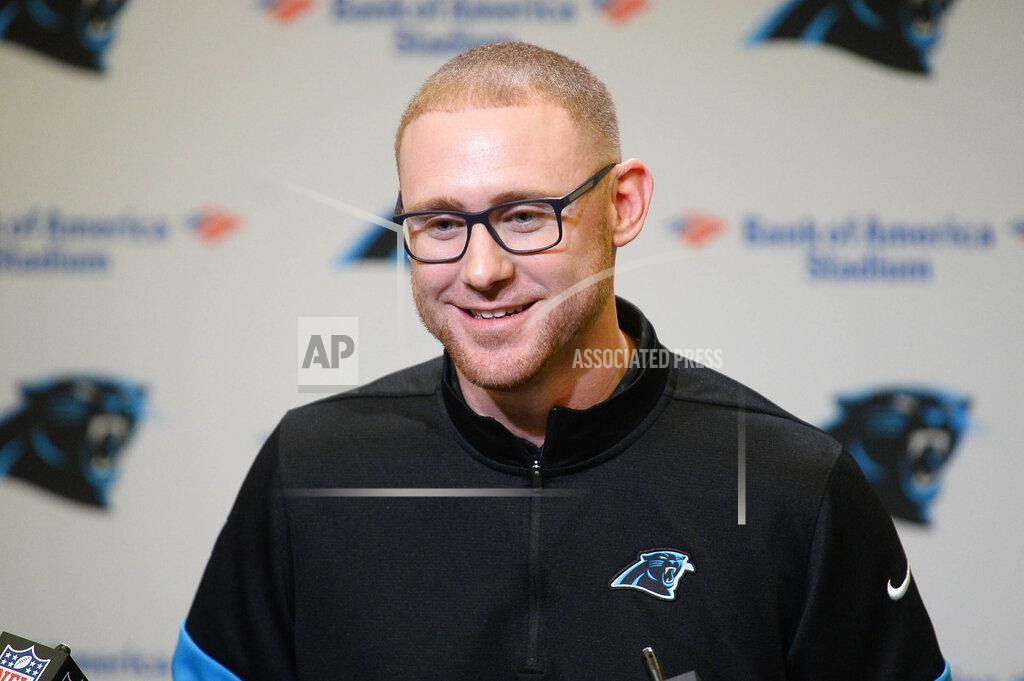 David T. Foster Iii Carolina Panthers NFL football team's new offensive coordinator Joe Brady listens to a question from the media during his introductory press conference at Bank of America Stadium in Charlotte, N.C., Friday, Jan. 17, 2020. (David T. Foster III/The Charlotte Observer via AP)
