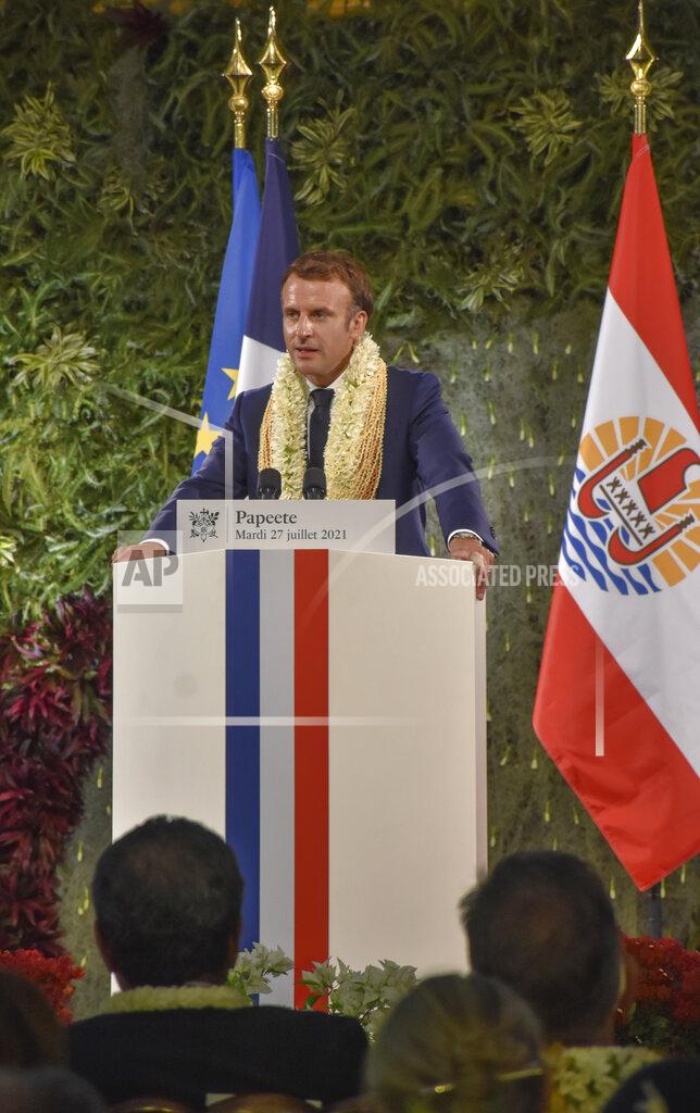 Esther Cuneo France's President Emmanuel Macron wearing a flower lei and seashell necklaces delivers a speech after a meeting with the President of the French Polynesia Edouard Fritch in Tahiti, French Polynesia in the Pacific Ocean, Tuesday, 27, 2021.President Emmanuel Macron reasserted France's presence in the Pacific on a visit to French Polynesia aimed in part at countering growing Chinese dominance in the region. (AP Photo/Esther Cuneo)