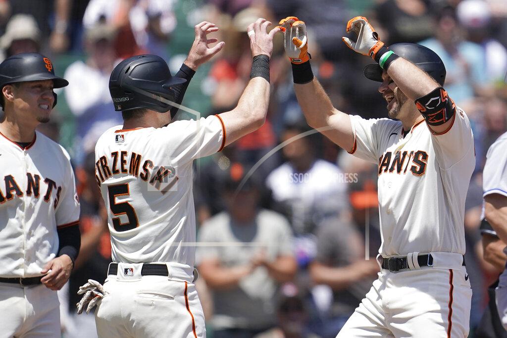 Jeff Chiu San Francisco Giants' Evan Longoria, right, celebrates after hitting a three-run home run that scored Wilmer Flores, left, and Mike Yastrzemski (5) during the first inning of a baseball game against the New York Mets in San Francisco, Wednesday, May 25, 2022. (AP Photo/Jeff Chiu)