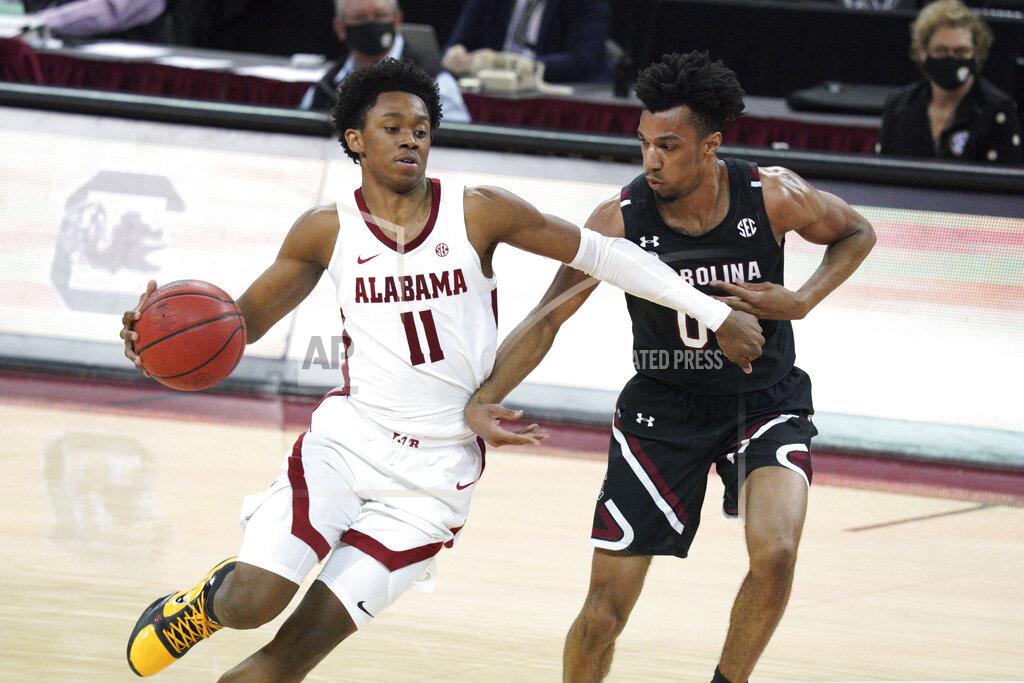 Sean Rayford FILE - In this Feb. 9, 2021, file photo, Alabama guard Joshua Primo (11) drives against South Carolina guard AJ Lawson (00) during an NCAA college basketball game in Columbia, S.C. Primo was selected by the San Antonio Spurs in the NBA draft Thursday, July 29, 2021. (AP Photo/Sean Rayford, File)