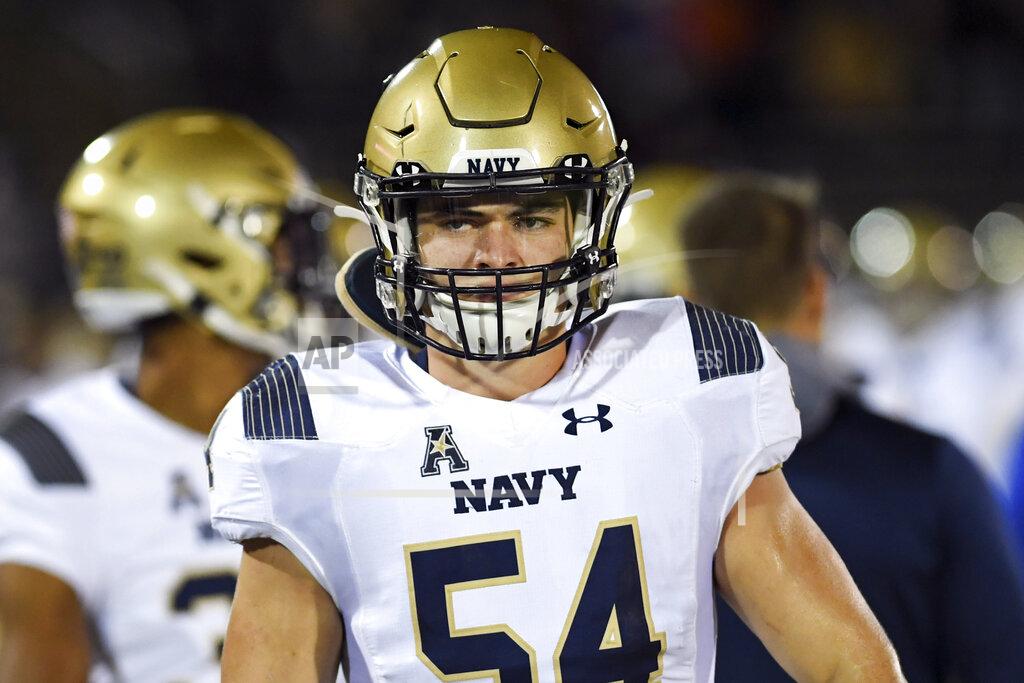 FILE - Navy linebacker Diego Fagot (54) gets ready to go in during the first half of an NCAA college football game against Connecticut, Friday, Nov. 1, 2019, in East Hartford, Conn. The key to the Navy defense is 6-foot-3, 240-pound linebacker Diego Fagot, who led the Midshipmen with 100 tackles last year as a sophomore. (AP Photo/Stephen Dunn, File)