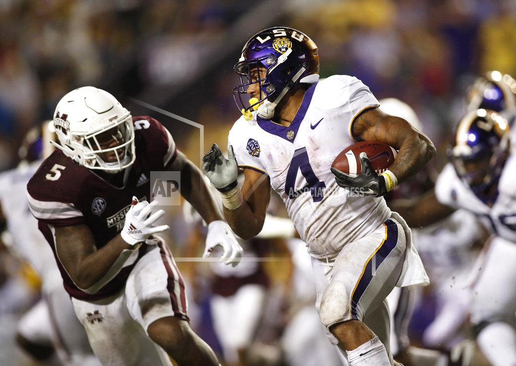Tyler Kaufman LSU running back Nick Brossette (4) runs past Mississippi State defensive end Chauncey Rivers (5) during an NCAA college football game in Baton Rouge, La., Saturday, Oct. 20, 2018. LSU won 19-3. (AP Photo/Tyler Kaufman)