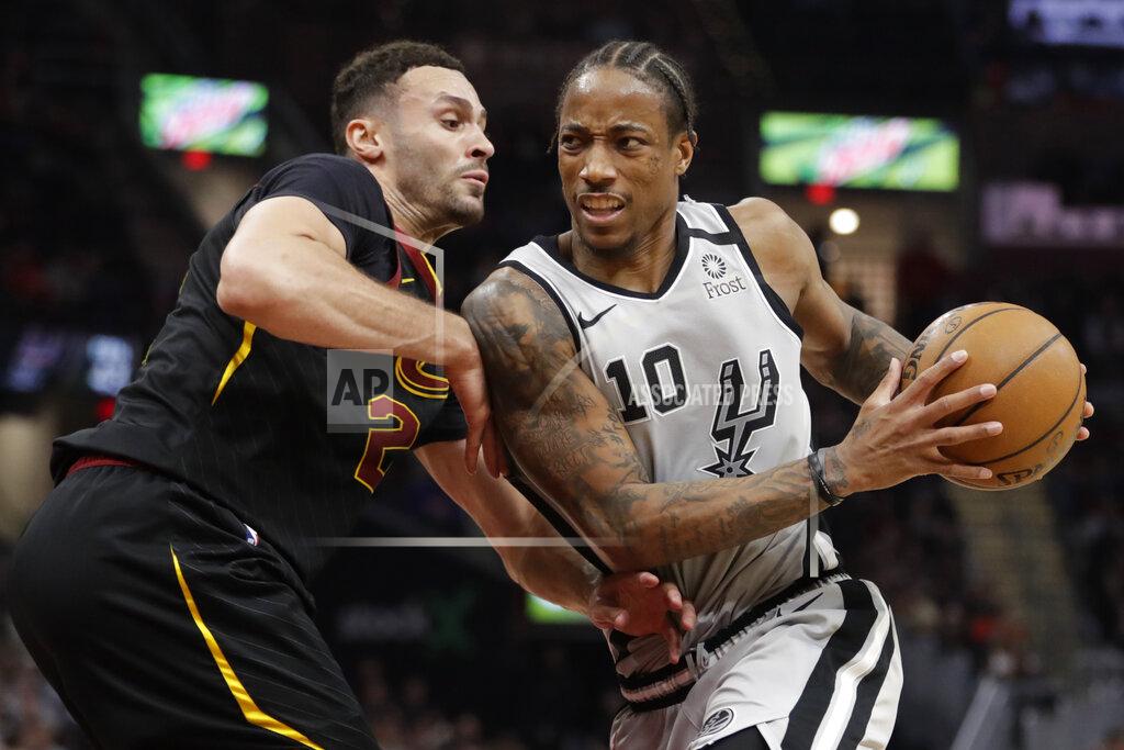 Tony Dejak FILE - In this Sunday, March 8, 2020 file photo, San Antonio Spurs' DeMar DeRozan (10) drives past Cleveland Cavaliers' Larry Nance Jr. (22) in the second half of an NBA basketball game in Cleveland. The unusual resumption of the NBA season during the coronavirus pandemic is making mental health a priority. Mental health has been a major priority for the NBA and the NBPA, especially after players like Cleveland’s Kevin Love and San Antonio’s DeMar DeRozan opened up about their personal experiences and inner struggles.(AP Photo/Tony Dejak, File)