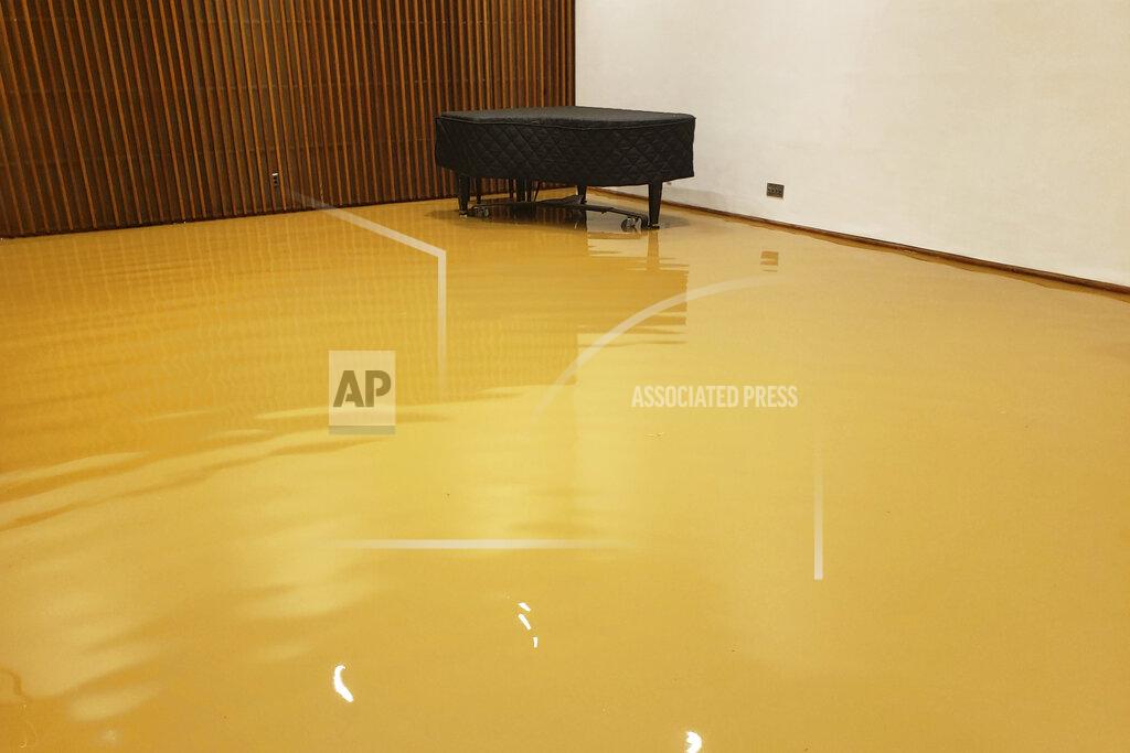 This Monday, Jan. 4, 2020 photo provided by Saint Peter's Lutheran Church shows flood damage in the music room of their church in the Manhattan borough of New York after a water main break. The Lutheran church was already reeling from the COVID-19 deaths of more than 60 congregation members during the pandemic. (Saint Peter's Lutheran Church via AP)