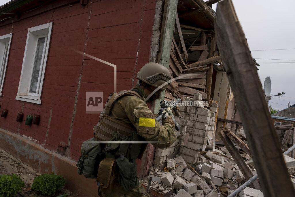 Mstyslav Chernov A Ukrainian serviceman patrols during a reconnaissance mission in a recently retaken village on the outskirts of Kharkiv, east Ukraine, Saturday, May 14, 2022. (AP Photo/Mstyslav Chernov)
