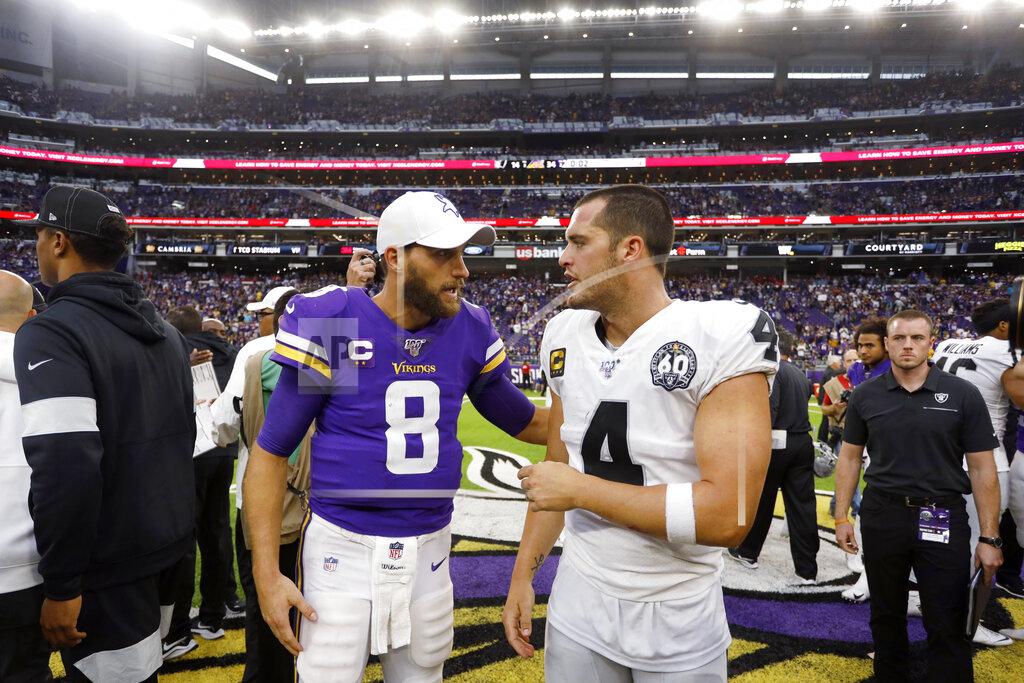 Bruce Kluckhohn Minnesota Vikings quarterback Kirk Cousins, left, talks with Oakland Raiders quarterback Derek Carr after an NFL football game, Sunday, Sept. 22, 2019, in Minneapolis. The Vikings won 34-14. (AP Photo/Bruce Kluckhohn)