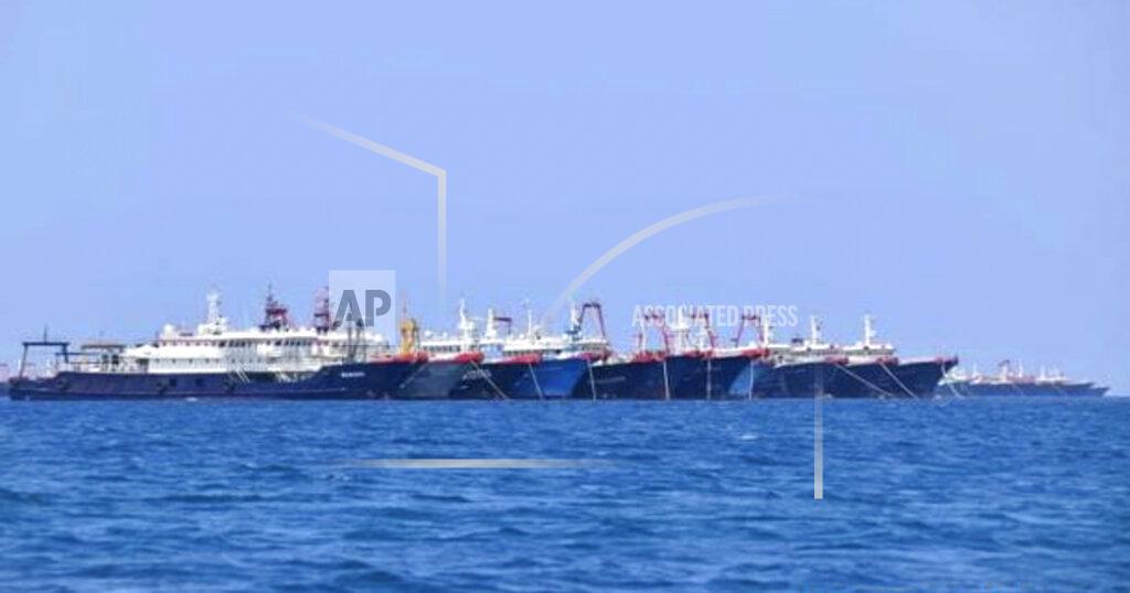 Uncredited In this Sunday, March 7, 2021, photo provided Sunday, March 21, 2021, by the Philippine Coast Guard/National Task Force-West Philippine Sea, some of the 220 Chinese vessels are seen moored at Whitsun Reef, South China Sea. The Philippine government expressed concern after spotting more than 200 Chinese fishing vessels it believed were crewed by militias at a reef claimed by both countries in the South China Sea, but it did not immediately lodge a protest. (Philippine Coast Guard/National Task Force-West Philippine Sea via AP)