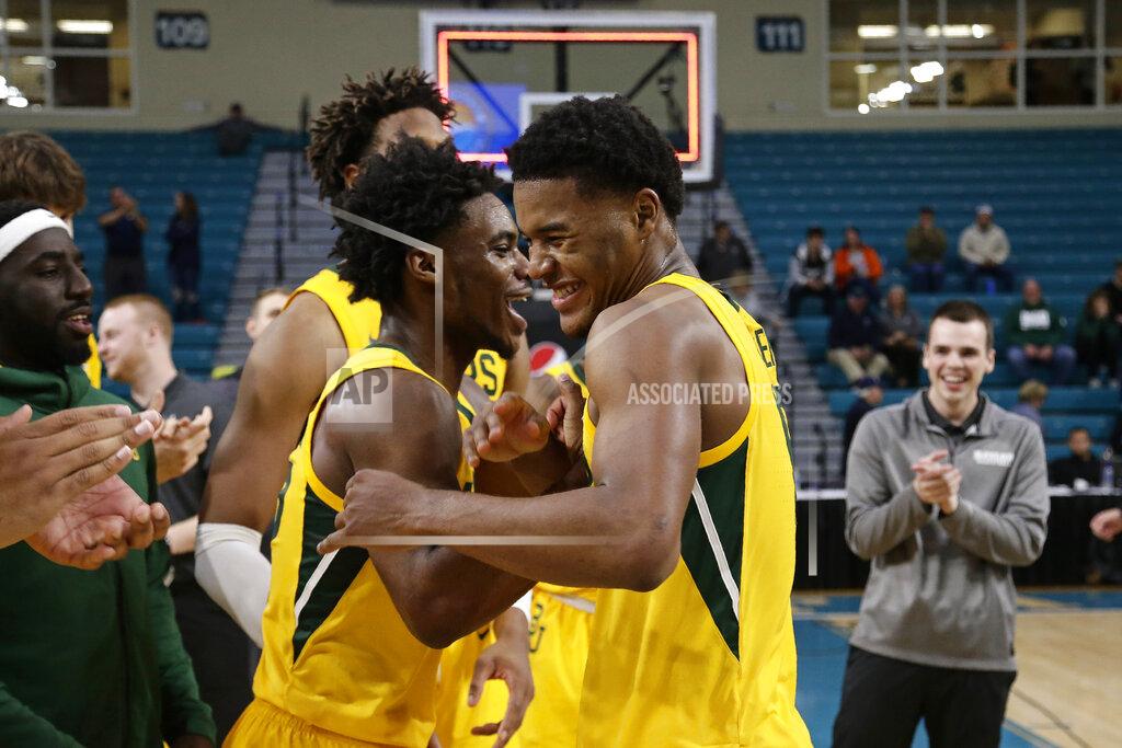 Gerry Broome Baylor guard Davion Mitchell, left, and most valuable player, guard Jared Butler celebrate following an NCAA college basketball championship game against Villanova at the Myrtle Beach Invitational in Conway, S.C., Sunday, Nov. 24, 2019. Baylor won 87-78. (AP Photo/Gerry Broome)