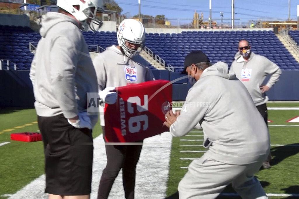 Devon Dalton In this image provided by WaV Sports & Entertainment + The NFL Alumni Academy, Mike Tice, front right, coaches at the NFL Alumni Academy at Tom Benson Stadium in Canton, Ohio on Nov. 4, 2020. In normal times, NFL teams sometimes must scramble to find players during the season when a wave of injuries or other issues hit. In 2020, multiply those needs exponentially because of the coronavirus pandemic. Helping out the 32 teams on a limited scale, for now, is the NFL Alumni Academy. (Devon Dalton/WaV Sports & Entertainment + The NFL Alumni Academy via AP)