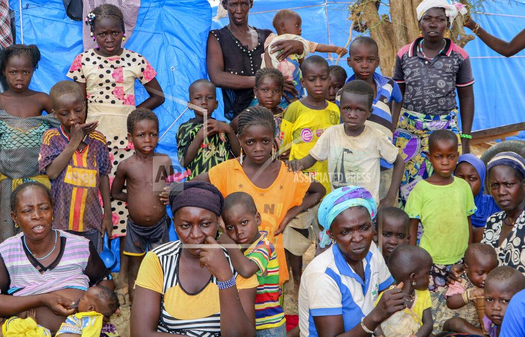 Sam Mednick Women and children sit outside their tents in a makeshift site for displaced people in Kongoussi, Burkina Faso, Thursday, June 4, 2020. Jihadist violence has dramatically escalated in Burkina Faso in recent years. The country's military has struggled to contain the violence. (AP Photo/Sam Mednick)