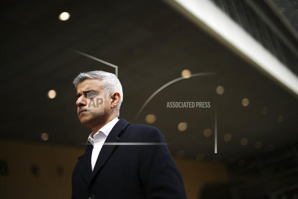 Francisco Seco FILE - In this Tuesday, Feb. 18, 2020 file photo London Mayor Sadiq Khan talks to journalists following his meeting with European Commission's Head of Task Force for Relations with the United Kingdom Michel Barnier at the EU headquarters in Brussels. On May 6, Londoners will elect a mayor, whose performance will help determine whether this is the start of a period of decline for Europe's biggest city — or a chance to do things better. Current Mayor Sadiq Khan, who is favored to win re-election, says his top priority is preserving jobs threatened by the economic blow of the pandemic. (AP Photo/Francisco Seco, File)