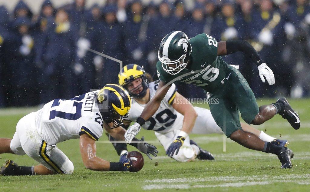 Carlos Osorio Michigan State punt returner Shakur Brown (29) fumbles as Michigan's Joe Hewlett (27) recovers during the second half of an NCAA college football game, Saturday, Oct. 20, 2018, in East Lansing, Mich. (AP Photo/Carlos Osorio)
