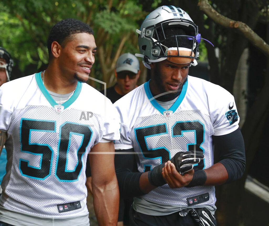 Jason E. Miczek Carolina Panthers NFL football rookie defensive player Brian Burns, right, walks to practice alongside fellow defensive rookie Christian Miller Monday, June 3, 2019, in Charlotte, N.C. (AP Photo/Jason E. Miczek)