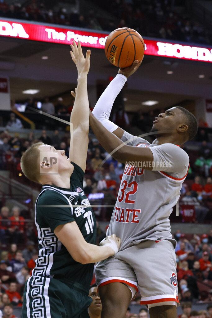 Jay Laprete Ohio State's E.J. Liddell, right, shoots over Michigan State's Joey Hauser during the second half of an NCAA college basketball game Thursday, March 3, 2022, in Columbus, Ohio. (AP Photo/Jay LaPrete)