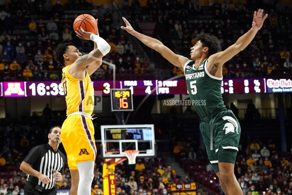 Craig Lassig Minnesota guard Payton Willis, left, shoots over Michigan State guard Max Christie during the first half an NCAA college basketball game Wednesday, Dec. 8, 2021, in Minneapolis. (AP Photo/Craig Lassig)