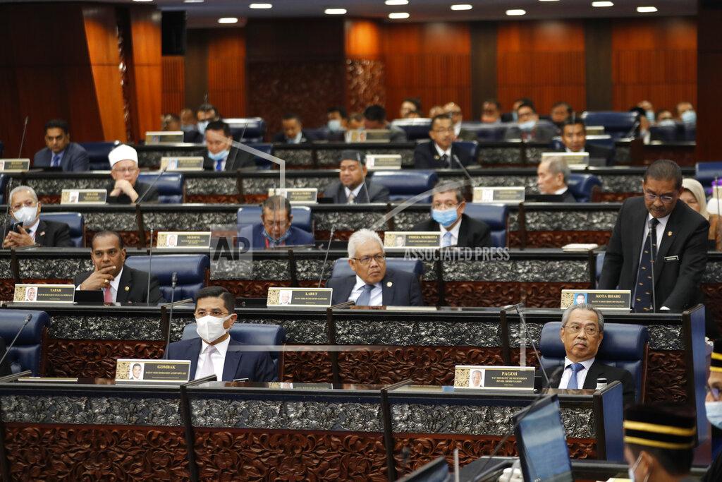 Vincent Thian Prime Minister Muhyiddin Yassin attending parliament session at parliament lower house in Kuala Lumpur, Malaysia, Monday, July 13, 2020. (AP Photo/Vincent Thian)