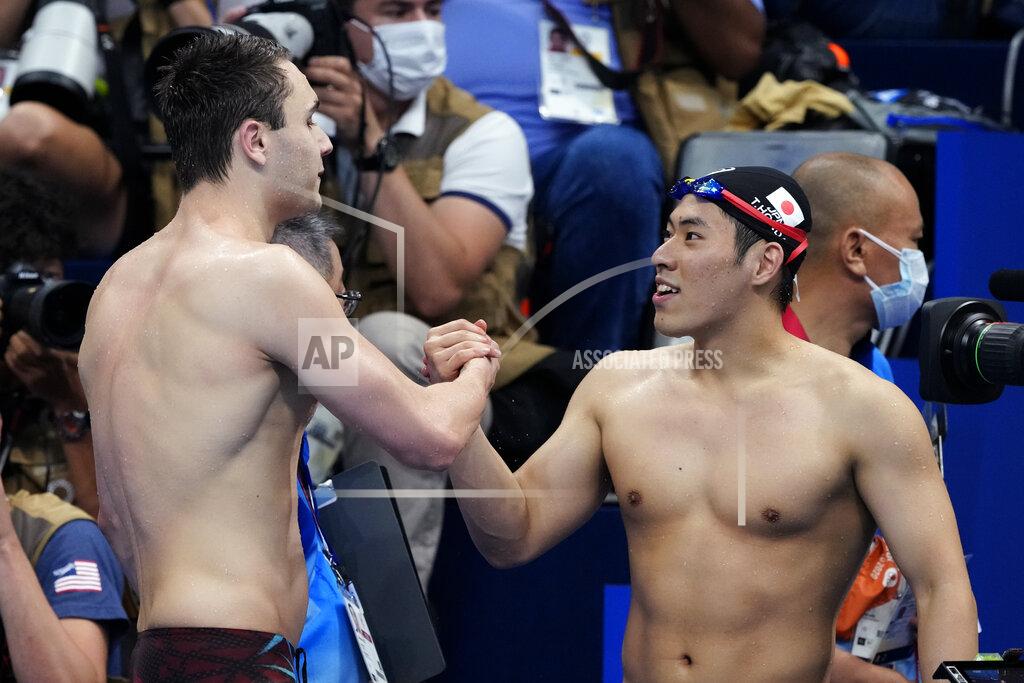 Martin Meissner Kristof Milak, left, of Hungary, is congratulated by second placed Tomoru Honda, of Japan, after winning the men's 200-meter butterfly final after at the 2020 Summer Olympics, Wednesday, July 28, 2021, in Tokyo, Japan. (AP Photo/Martin Meissner)