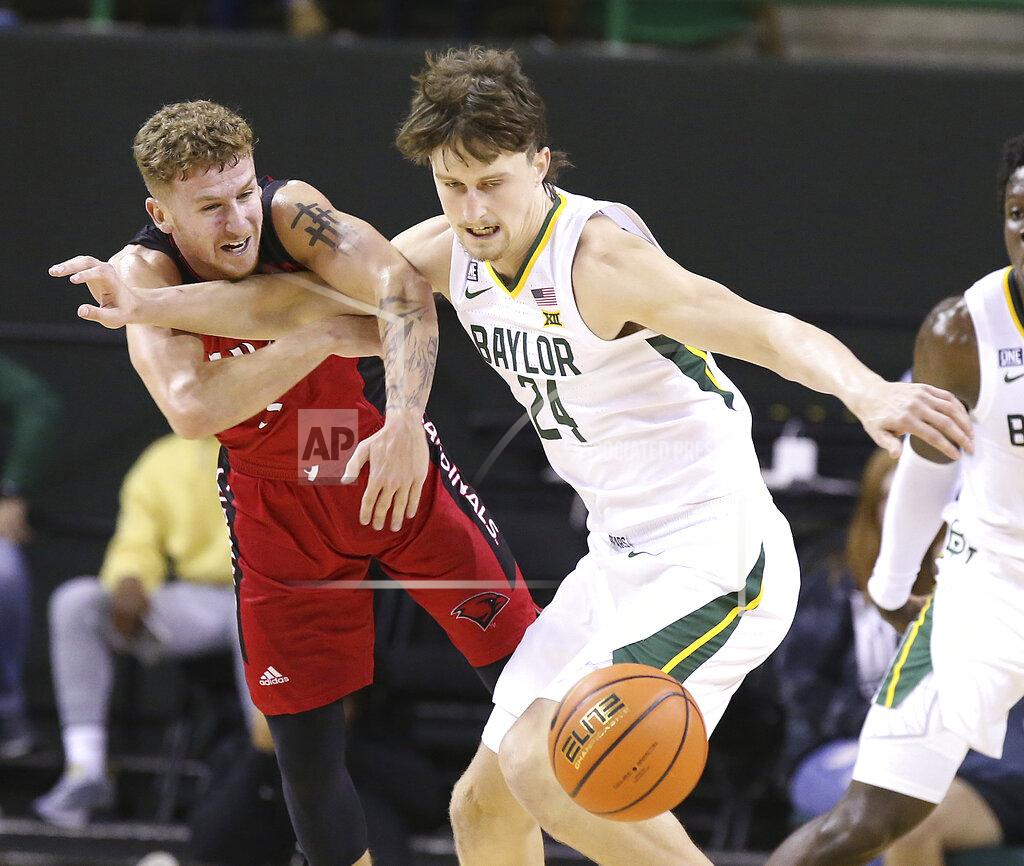 Jerry Larson Baylor guard Matthew Mayer (24) steals the ball from Incarnate Word guard Drew Lutz (3) in the first half of an NCAA college basketball game, Friday, Nov. 12, 2021, in Waco, Texas. (AP Photo/Jerry Larson)/Waco Tribune-Herald via AP)