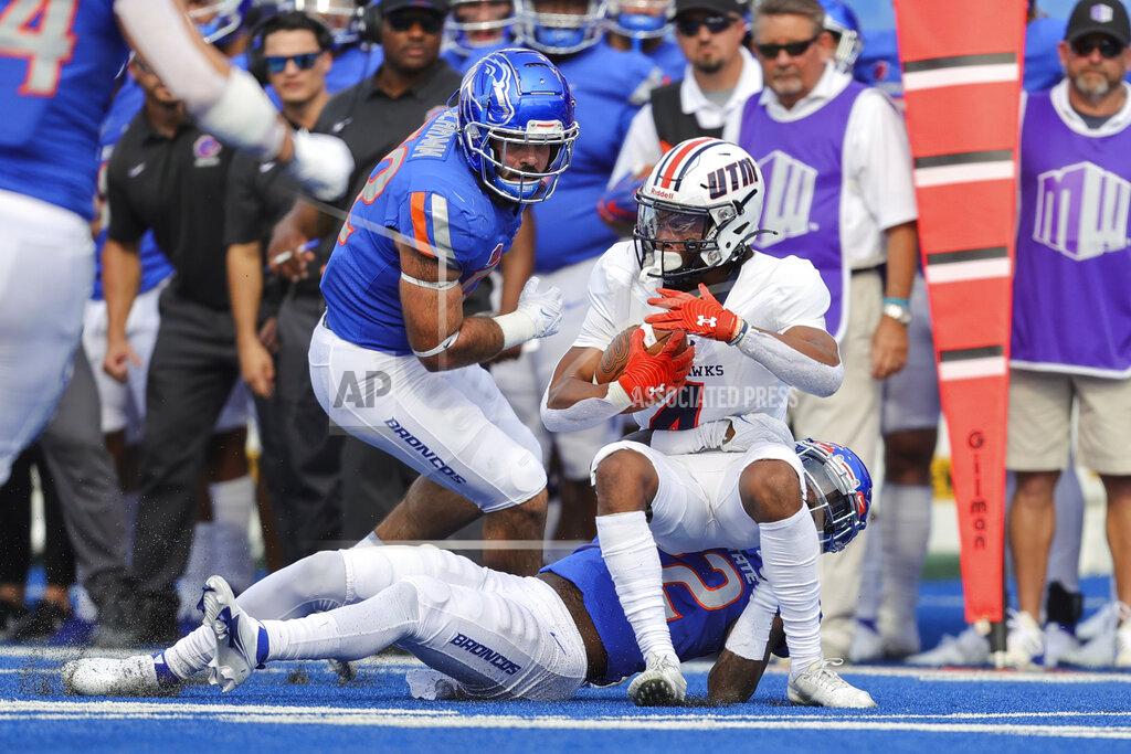 Steve Conner Tennessee-Martin wide receiver DeVonte Tanksley (4) is is pulled down by Boise State cornerback Tyric LeBeauf (22) as Boise State linebacker DJ Schramm (52) comes into finish the tackle in the second half of an NCAA college football game, Saturday, Sept. 17, 2022, in Boise, Idaho. (AP Photo/Steve Conner)