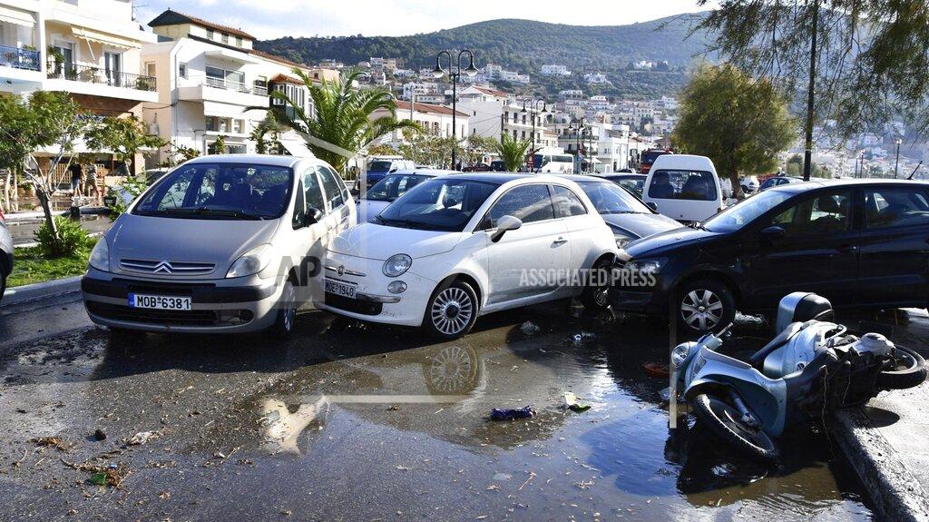 Michael Svarnias Cars are piled after an earthquake at the port of Vathi on the eastern Aegean island of Samos, Greece, Friday, Oct. 30, 2020. A strong earthquake struck in the Aegean Sea between the Turkish coast and the Greek island of Samos as the magnitude 6.6 earthquake was centered in the Aegean at a depth of 16.5 kilometers, or 10.3 miles.(AP Photo/Michael Svarnias)
