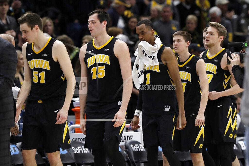 Nam Y. Huh Iowa players walk off the court after an NCAA college basketball game against Michigan in the quarterfinals of the Big Ten Conference tournament, Friday, March 15, 2019, in Chicago. Michigan won 74-53. (AP Photo/Nam Y. Huh)