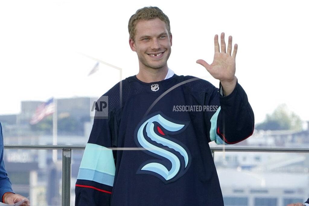 Ted S. Warren Jamie Oleksiak, a defenseman from the Dallas Stars, is introduced as a new player with the Seattle Kraken NHL hockey team, Wednesday, July 21, 2021, during the Kraken's NHL expansion draft event in Seattle. (AP Photo/Ted S. Warren)