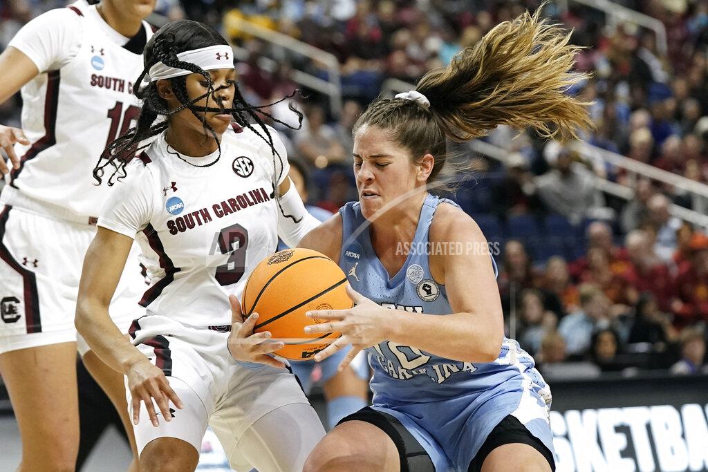 Gerry Broome South Carolina guard Destanni Henderson (3) defends against North Carolina guard Eva Hodgson, right, during the first half of a college basketball game in the Sweet 16 round of the NCAA tournament in in Greensboro, N.C., Friday, March 25, 2022. (AP Photo/Gerry Broome)