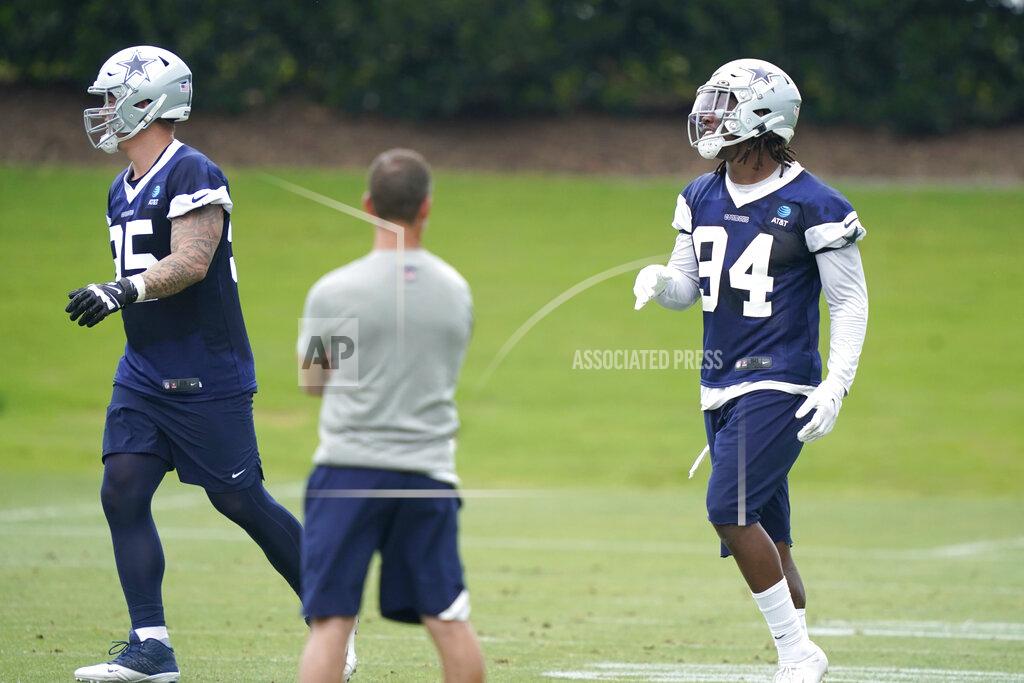 Lm Otero Dallas Cowboys defensive end Randy Gregory (94) runs drills with teammate Brent Urban (85) during an NFL football team practice Wednesday, June 9, 2021, in Frisco, Texas. Gregory isn't ashamed of a suspension-filled past that nearly derailed his NFL career, just maybe a little tired of it being the focus of his story. (AP Photo/LM Otero)