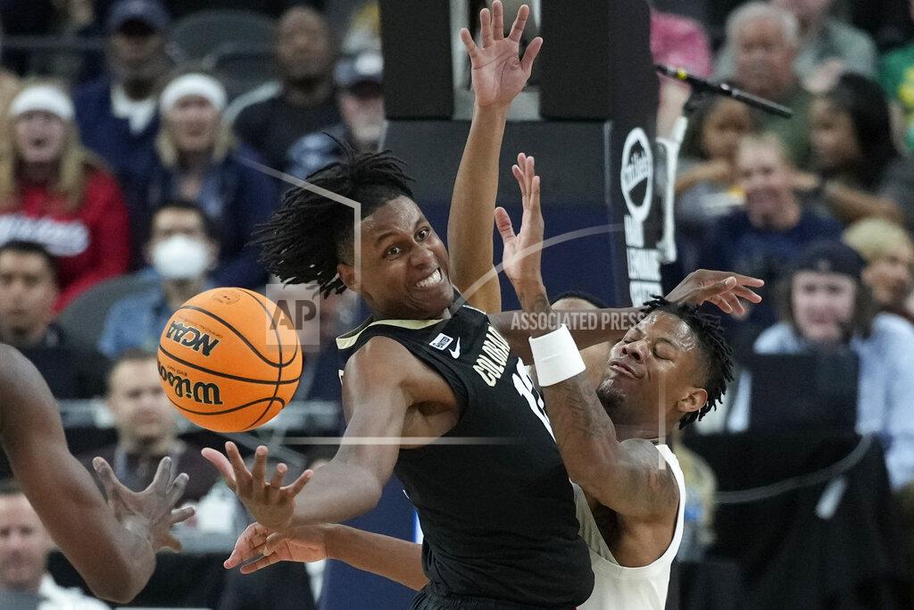 John Locher Colorado's Jabari Walker, left, and Arizona's Dalen Terry (4) battle for a rebound during the second half of an NCAA college basketball game in the semifinal round of the Pac-12 tournament Friday, March 11, 2022, in Las Vegas. (AP Photo/John Locher)