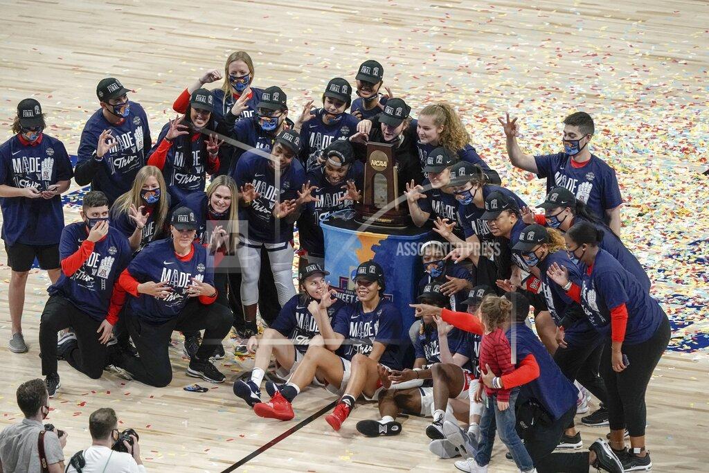 Morry Gash The Arizona team poses for a picture after an NCAA college basketball game against Indiana in the Elite Eight round of the Women's NCAA tournament Monday, March 29, 2021, at the Alamodome in San Antonio. Arizona won 66-53 to advance to the Final Four. (AP Photo/Morry Gash)