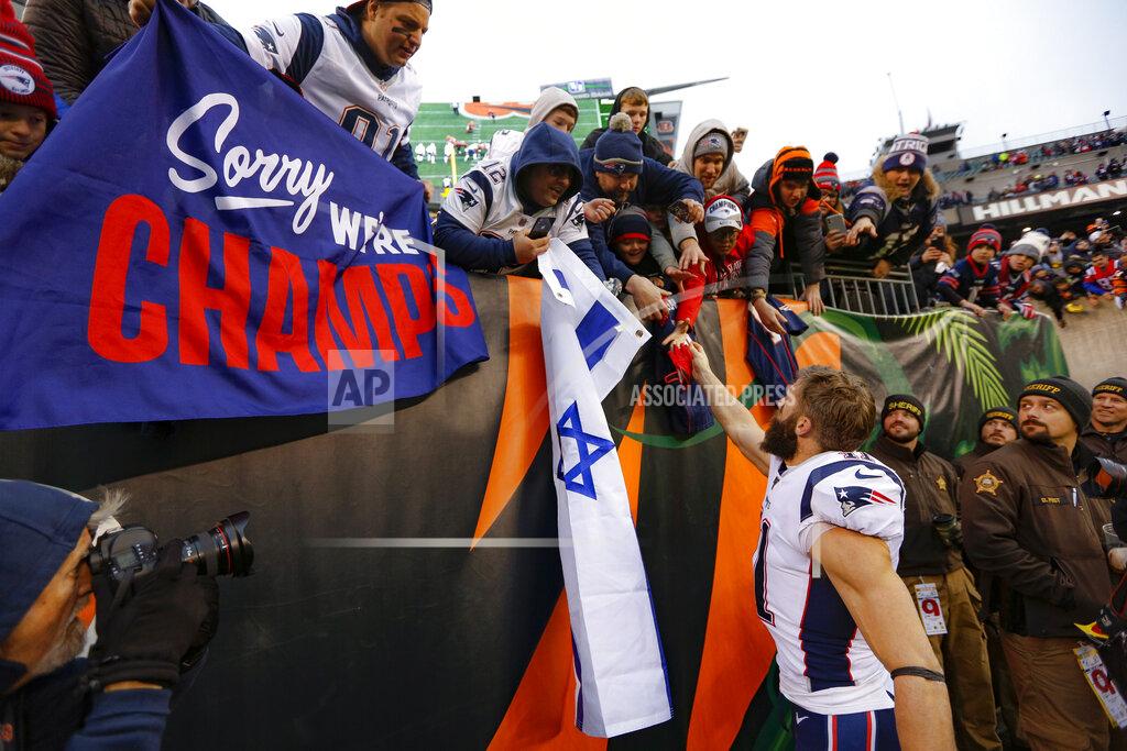 Frank Victores New England Patriots wide receiver Julian Edelman (11) gives away his gloves to fans after an NFL football game against the Cincinnati Bengals, Sunday, Dec. 15, 2019, in Cincinnati. (AP Photo/Frank Victores)