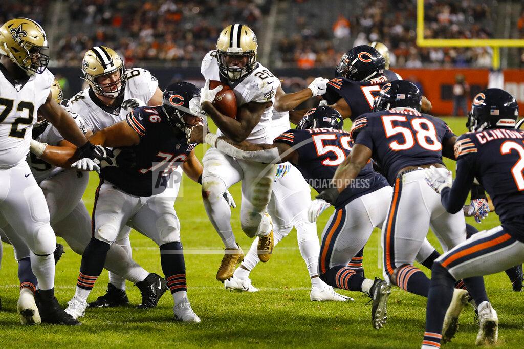 Charles Rex Arbogast New Orleans Saints running back Latavius Murray (28) runs in for a touchdown between Chicago Bears defensive tackle Abdullah Anderson (76) and inside linebacker Danny Trevathan (59) during the second half of an NFL football game in Chicago, Sunday, Oct. 20, 2019. (AP Photo/Charles Rex Arbogast)