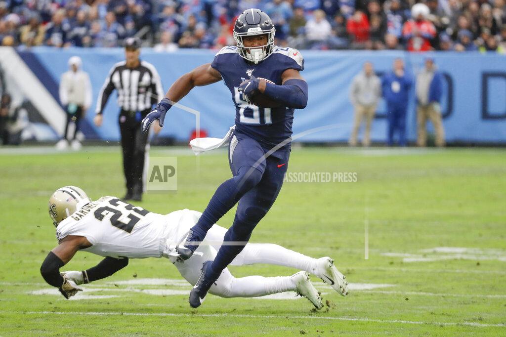 James Kenney Tennessee Titans tight end Jonnu Smith (81) gets past New Orleans Saints defensive back Chauncey Gardner-Johnson (22) as Smith scores a touchdown in the first half of an NFL football game Sunday, Dec. 22, 2019, in Nashville, Tenn. (AP Photo/James Kenney)