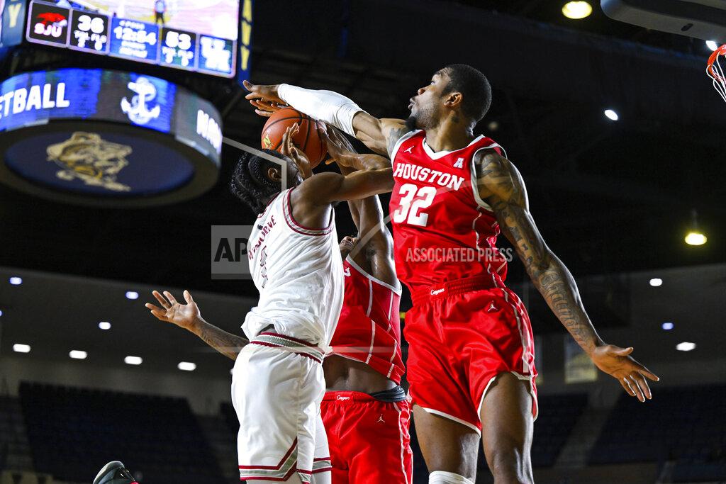 Terrance Williams Saint Joseph's guard Christian Winborne has his shot blocked by Houston forward Reggie Chaney (32) during the second half of an NCAA college basketball game at the Veterans Classic, Friday, Nov. 11, 2022, in Annapolis, Md. (AP Photo/Terrance Williams)