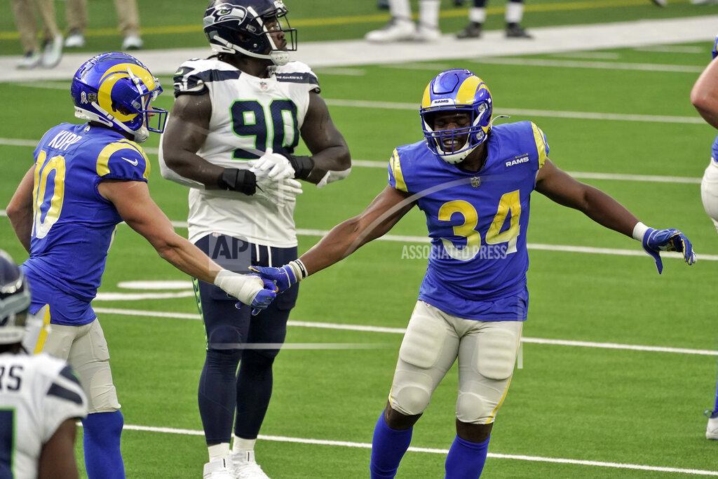 Jae C. Hong Los Angeles Rams running back Malcolm Brown (34) celebrates after scoring with Los Angeles Rams' Cooper Kupp, left, during the first half of an NFL football game against the Seattle Seahawks Sunday, Nov. 15, 2020, in Inglewood, Calif. (AP Photo/Jae C. Hong)