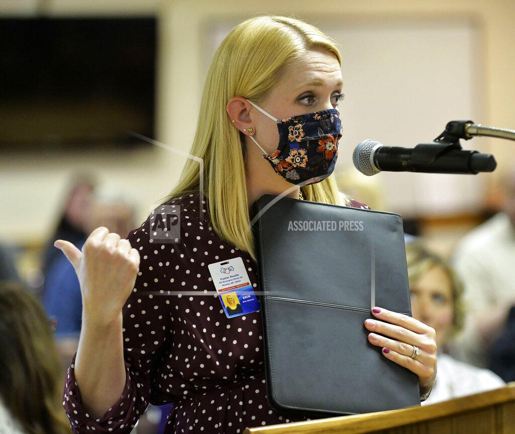 Custer Health Administrator Erin Ourada addresses the Morton County Commission on Thursday, Sept. 10, 2020, in Mandan, N.D. She spoke in favor of a mask mandate, which the commission rejected. Coronavirus infections in the Dakotas are growing faster than anywhere else in the nation, fueling impassioned debates over masks, personal responsibility and freedom after months in which the two states avoided the worst of the pandemic. (Will Kincaid/The Bismarck Tribune via AP)