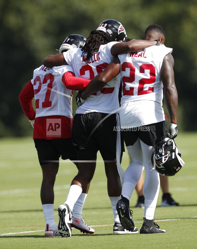 John Bazemore In this photo taken Monday, July, 22, 2019, Atlanta Falcons defensive back J.J. Wilcox (29) is helped off the field by teammates Damontae Kazee (27) and strong safety Keanu Neal (22) after being injured during their NFL training camp football practice Monday, July 22, 2019, in Flowery Branch, Ga.(AP Photo/John Bazemore)