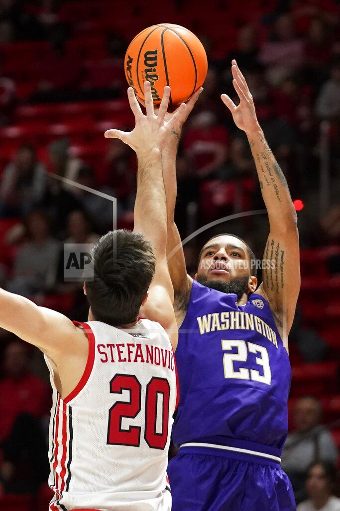Rick Bowmer Washington guard Terrell Brown Jr. (23) shoots as Utah guard Lazar Stefanovic (20) defends during the first half of an NCAA college basketball game Thursday, Jan. 6, 2022, in Salt Lake City. (AP Photo/Rick Bowmer)