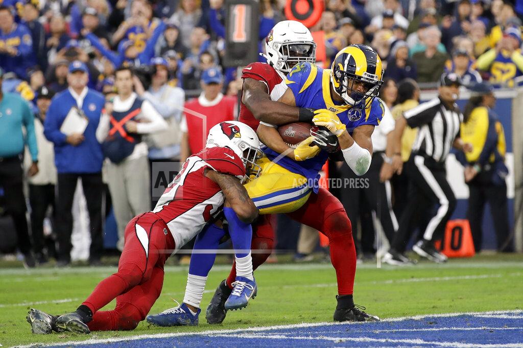 Marcio Jose Sanchez Los Angeles Rams wide receiver Robert Woods, middle, scores between Arizona Cardinals strong safety Budda Baker, left, and cornerback Patrick Peterson during second half of an NFL football game Sunday, Dec. 29, 2019, in Los Angeles. (AP Photo/Marcio Jose Sanchez)