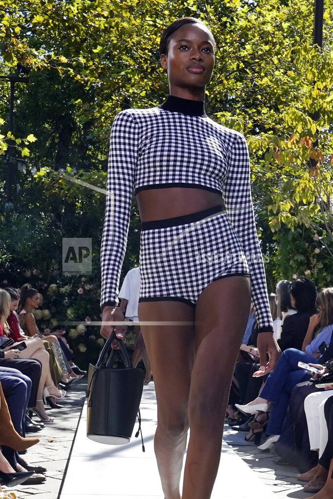 Richard Drew The Michael Kors Spring/Summer 2022 collection is modeled during Fashion Week, in New York, Friday, Sept. 10, 2021. (AP Photo/Richard Drew)