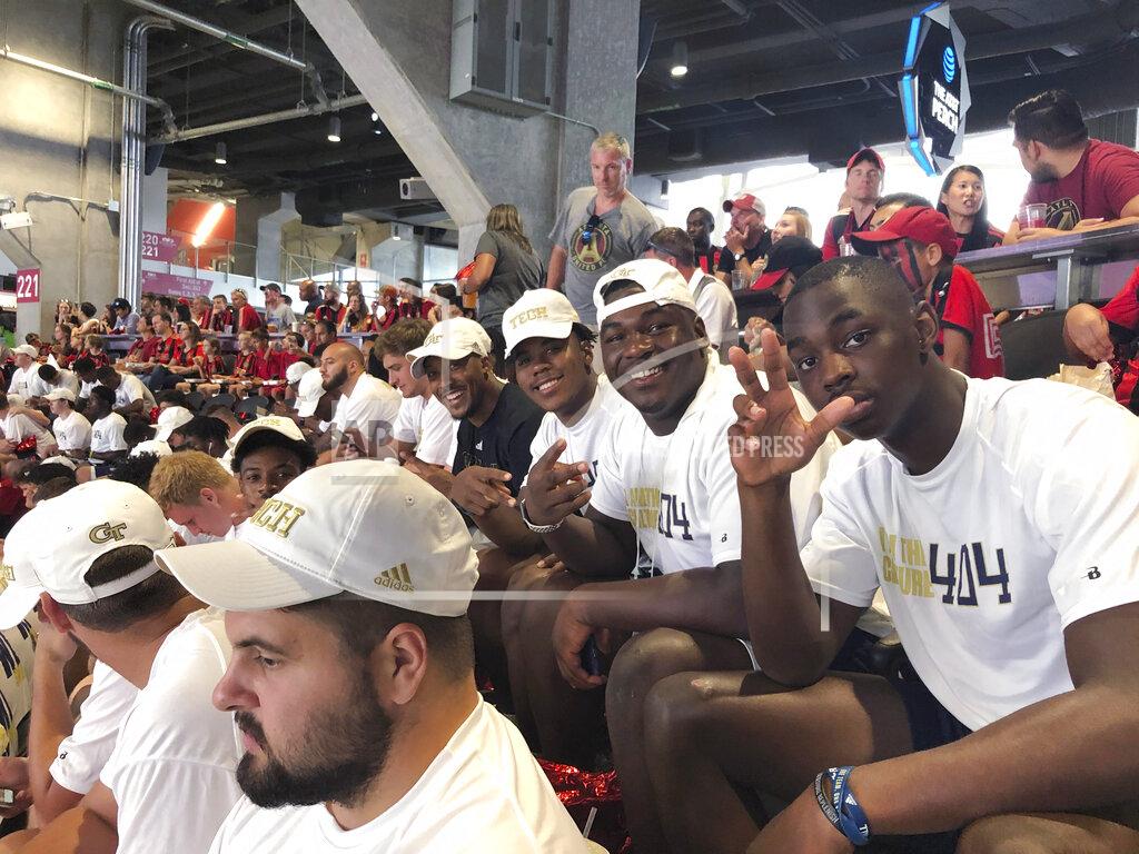 Paul Newberry Georgia Tech football players attend the MLS soccer match between Minnesota United and the LA Galaxy on Saturday, Aug. 3, 2019, in Atlanta. New Georgia Tech coach Geoff Collins set up the outing after his team's fan day at Bobby Dodd Stadium, part of his effort to make the Yellow Jackets a vibrant part of the city's sports culture. (AP Photo/Paul Newberry)